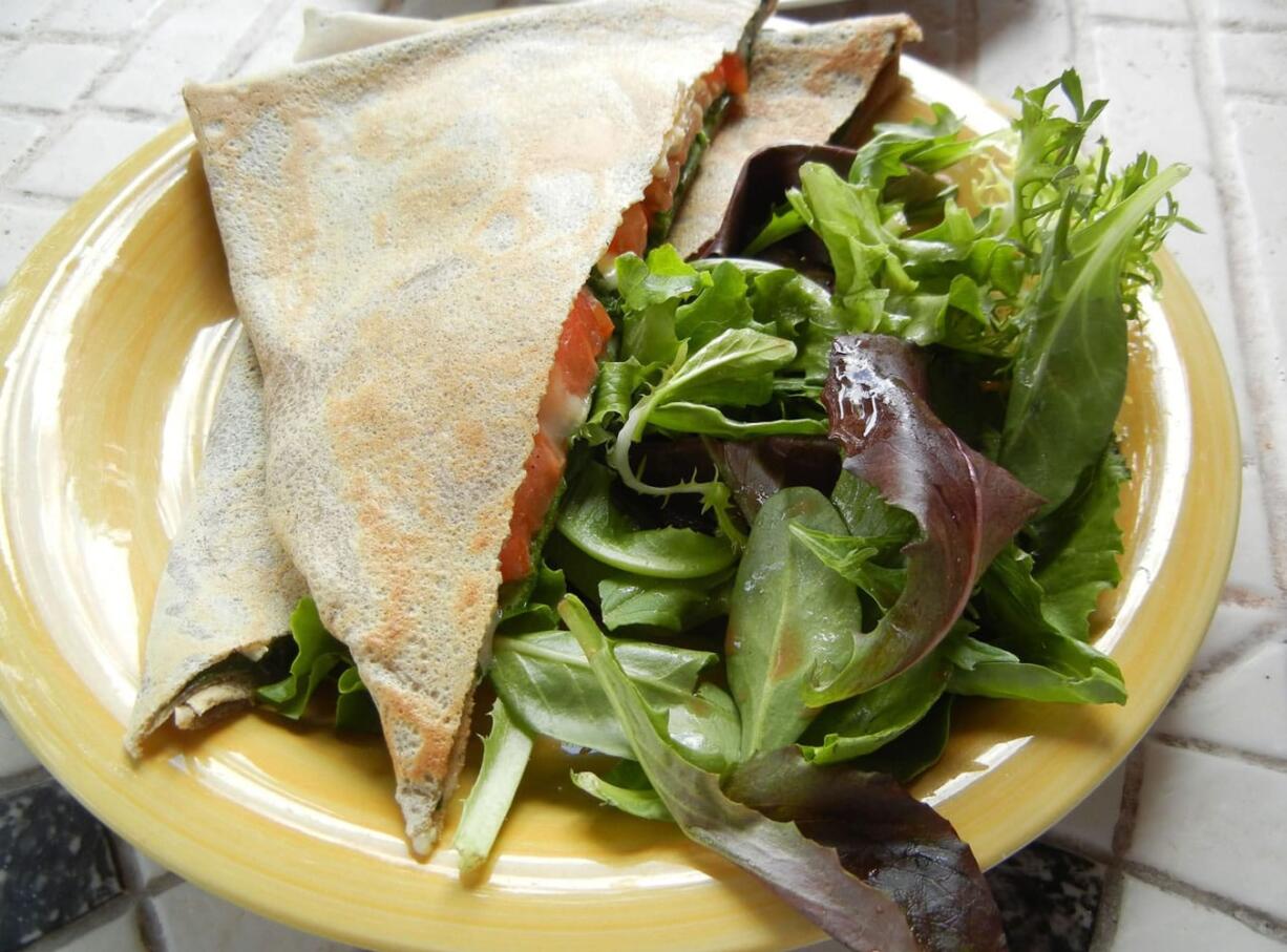 The Veggie crepe at Mon Ami contains lightly cooked baby spinach, tomatoes and cheese.