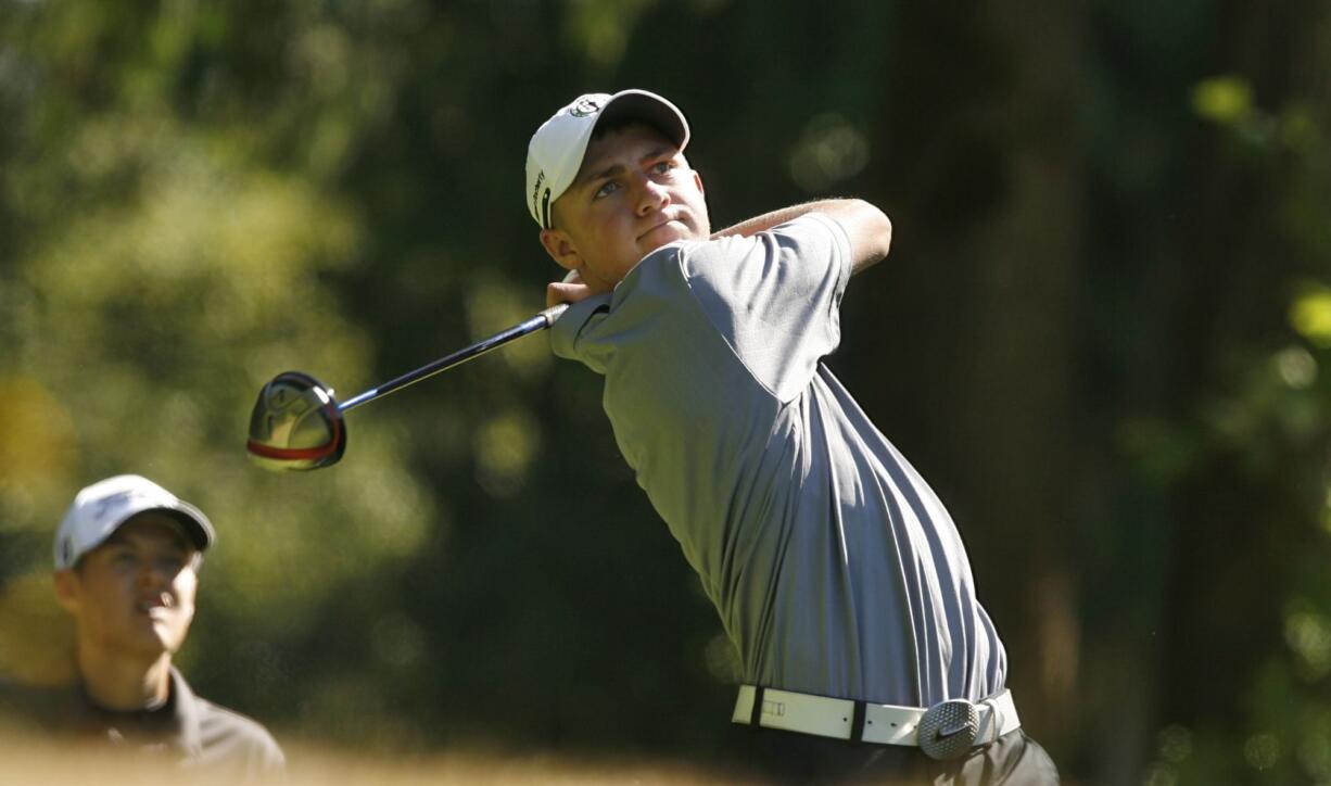 Union senior Alistair Docherty hits tee shot during a high school match at the Cedars at Salmon Creek golf course.