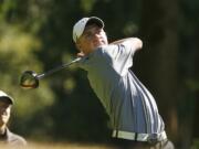 Union senior Alistair Docherty hits tee shot during a high school match at the Cedars at Salmon Creek golf course.