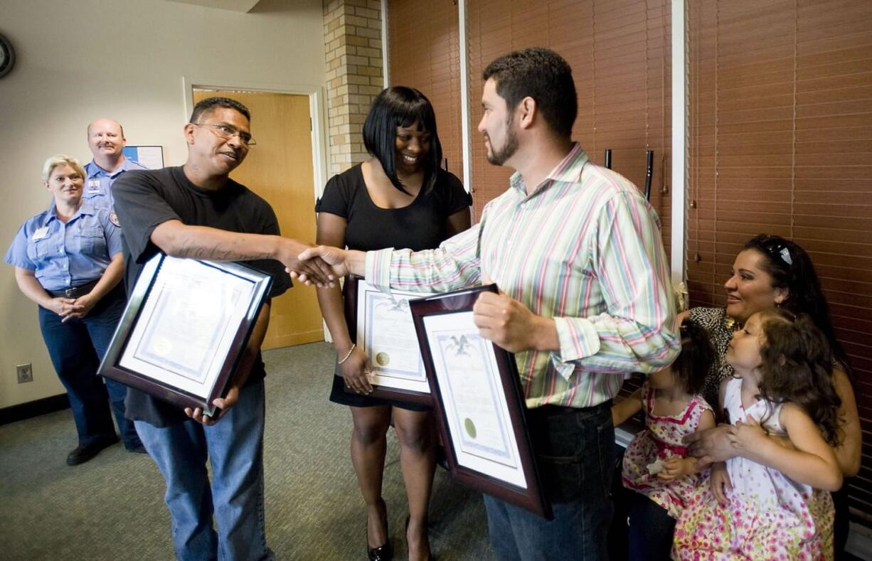 Bystanders from left, Mourice Hernandez, Keeona Vance and Jamie Pina receive Lifesaving Awards from Clark County Fire District 6 during a news conference at Legacy Emanuel Medical Center Thursday. The trio was acknowledged for performing CPR on 4-year-old Andrea Jack, who nearly drowned at Klineline Pond Sunday.