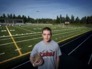 Former Camas football player Ikaika Gunderson had plans to play college ball at Southern Oregon University, but has been sidelined with post concussion symptoms.