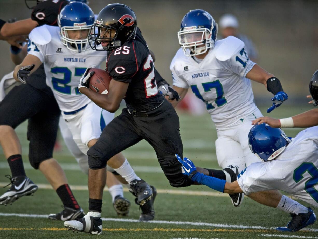 Camas High's Zach Marshall breaks free from Mountain View defenders during last week's game at Doc Harris Stadium.