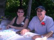 Sam Arola and his wife, Karen, enjoy some cake at the Fargher Lake's Appreciation Day celebration Sept.