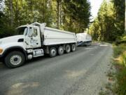 A J.L. Storedahl &amp; Sons truck hauls gravel from the Yacolt Mountain Quarry on Northeast Kelly Road.