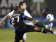 San Jose's Nana Attakora (27) defends against Portland's Kenny Cooper in the first half Wednesday.