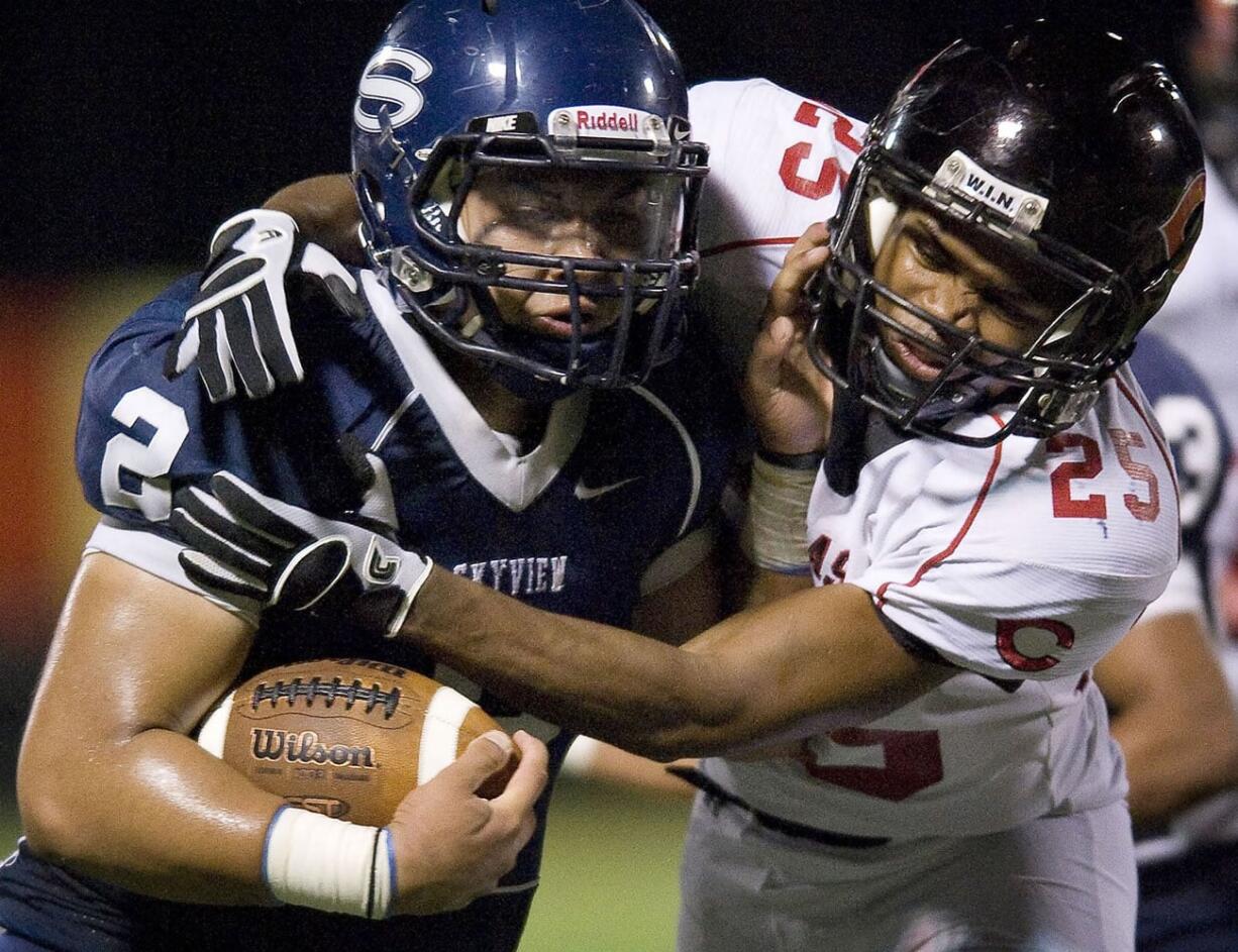 Skyview's Kieran McDonagh (2) threw two scoring passes and ran for a first down on this play before being stopped by Zack Marshall.