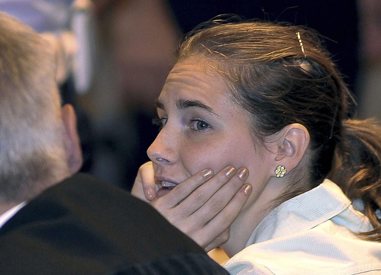 Amanda Knox attends an hearing of her appeals trial Saturday at the Perugia court, Italy. Italian prosecutors have urged an appeals court to uphold the murder conviction of Amanda Knox despite what they called a media campaign in support of the American student, asking the jurors to think instead of the young victim whose life was brutally ended.