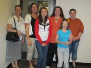 Lori Vance, from left, Jill Taylor, Kayla Morris, Desiree Tubbs, Kaitlin Hadfield and Brianne Tubbs presented 41 handmade quilts and scarves to the Children's Justice Center on Aug.