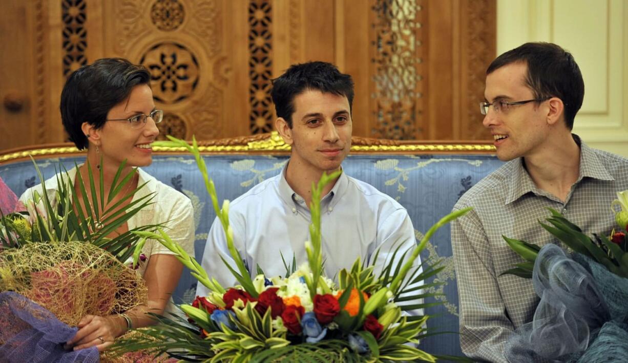 Sarah Shourd, from left, Josh Fattal and Shane Bauer are seen Saturday before leaving for the United States at the airport in Muscat, Oman.