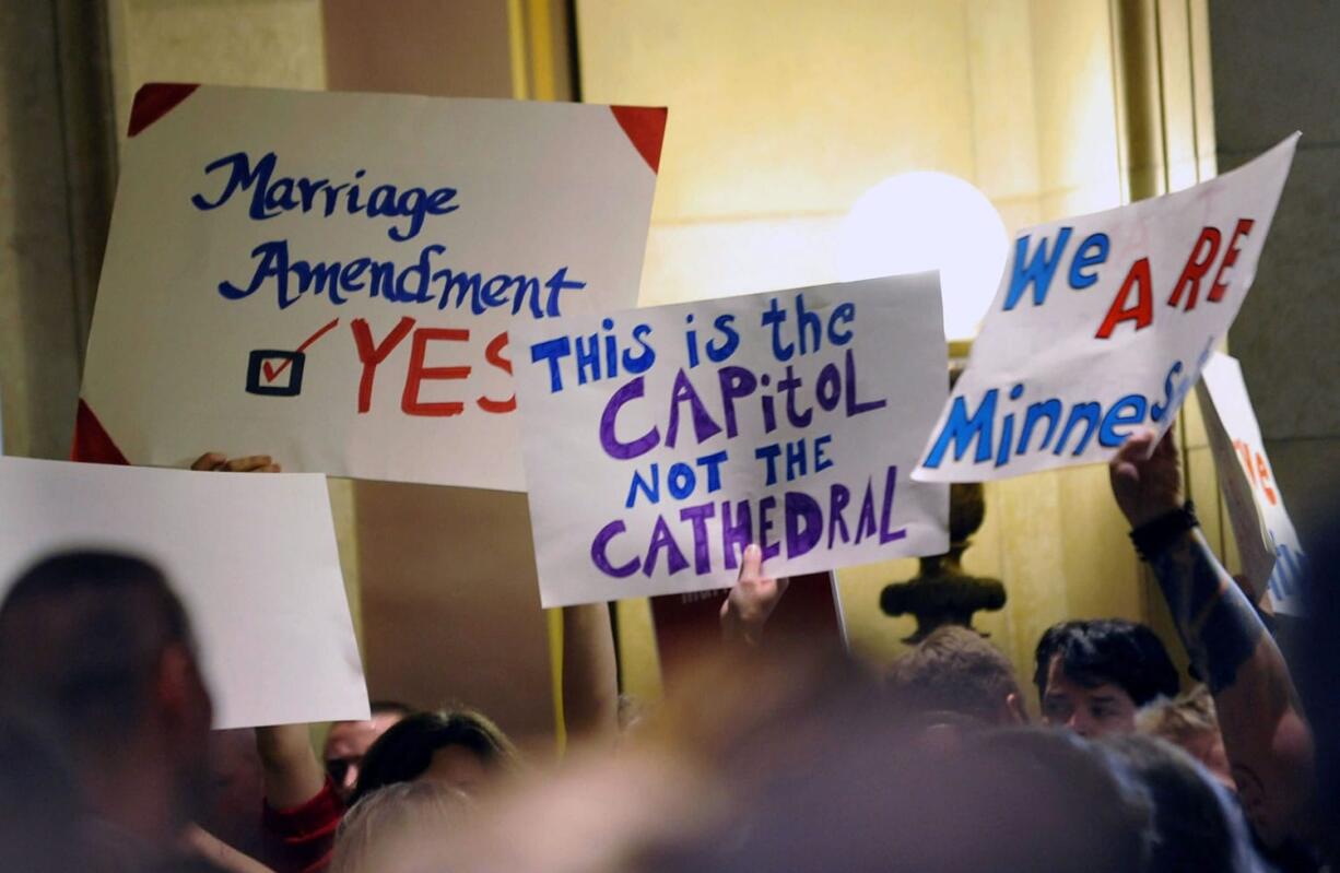 On this May 19, 2011 file photo, demonstrators on both sides of the gay marriage issue gathered outside the Minnesota House in St. Paul, Minn. The Census Bureau reports there are 131,729 same-sex couples in the U.S. who say they're married _ the first-ever government count of this kind.