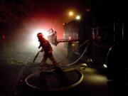 Firefighters deal with an attic fire inside a home on N.W.