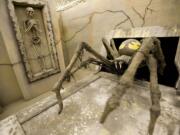 A pitbull-sized spider jumps out of the side of a box at Scream Vancouver.