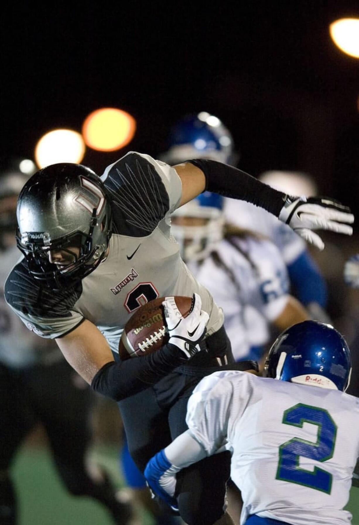 Union's Gabe Rego runs to the one-yard-line in the first half against Mountain View at McKenzie Stadium. The Titans scored on the next play.