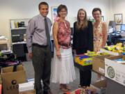 Alan Hamilton, from left, First Independent Bank senior manager of community investments, Jan Redding, Foundation for Vancouver Public Schools assistant director, Susan DeRenzo, First Independent Bank financial adviser, and Tara Taylor, Foundation for Vancouver Public Schools executive director, are surrounded by school supplies collected by the Foundation for Vancouver Public Schools.