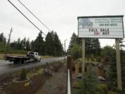 Businesses along Highway 502 near Dollars Corner are negotiating with the Washington State Department of Transportation about a highway widening project.