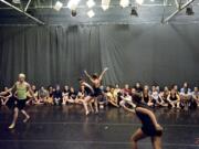 About 20 Heritage High dance students take part in a special workshop Wednesday put on by Pilobolus dance troupe at Body Vox Dance Center in Portland.