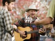 Fred Coates, center, jams with new friends at BirdFest and Bluegrass Saturday in Ridgefield.