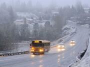 A Vancouver School District School bus makes its way across Salmon Creek along NW 36th Ave. Tuesday March 1, 2011 in Vancouver, Washington.