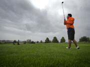 Heritage's Nick Regalado didn't let Tuesday's threatening skies keep him from wearing shorts at the Class 4A district golf tournament at Tri-Mountain Golf Course in Ridgefield.