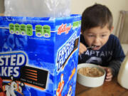 Nathaniel Donaker, 4, eats Kellogg's Frosted Flakes April 28 at his home in Palo Alto, Calif.