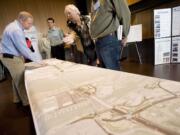 Columbia River Crossing engineering manager Casey Liles, left, answers a question during one of two open houses Wednesday at the Vancouver Community Library.