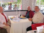 East Minnehaha: Frances and Walter Holy, left, are joined by Burgerville chief culture officer Jack Graves for a party at the Scholls and Allen restaurant in Beaverton, Ore.