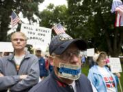 Vancouver resident Craig Murphy wore a symbolic muzzle Saturday to protest corporate power over politics.