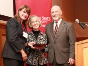 Salmon Creek: Barbe West, center, executive director of the Free Clinic of Southwest Washington, accepts the 2011 WSU Vancouver Community Award of Distinction for Community Partnership.