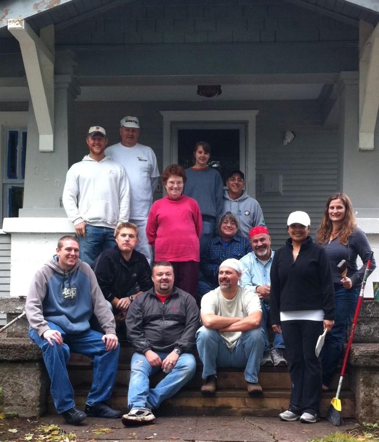 Volunteers helped paint the home of Barbara Donohoe as a part of A Brush With Kindness.