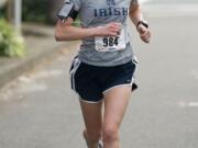 Carolyn Green of Ridgefield, a sophomore at Notre Dame, runs to victory Sunday in the Girlfriends Half Marathon in Vancouver.