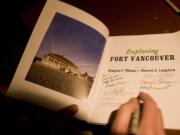 Contributors autograph &quot;Exploring Fort Vancouver&quot; during an Oct.