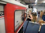 Machine operator Katrina West, 18, produces housings for humidifiers using injection molding.