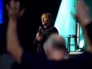 The Rev. John Bishop leads prayer during a staff meeting at the former Kmart store on Andresen Road -- now the new home of Living Hope Church.