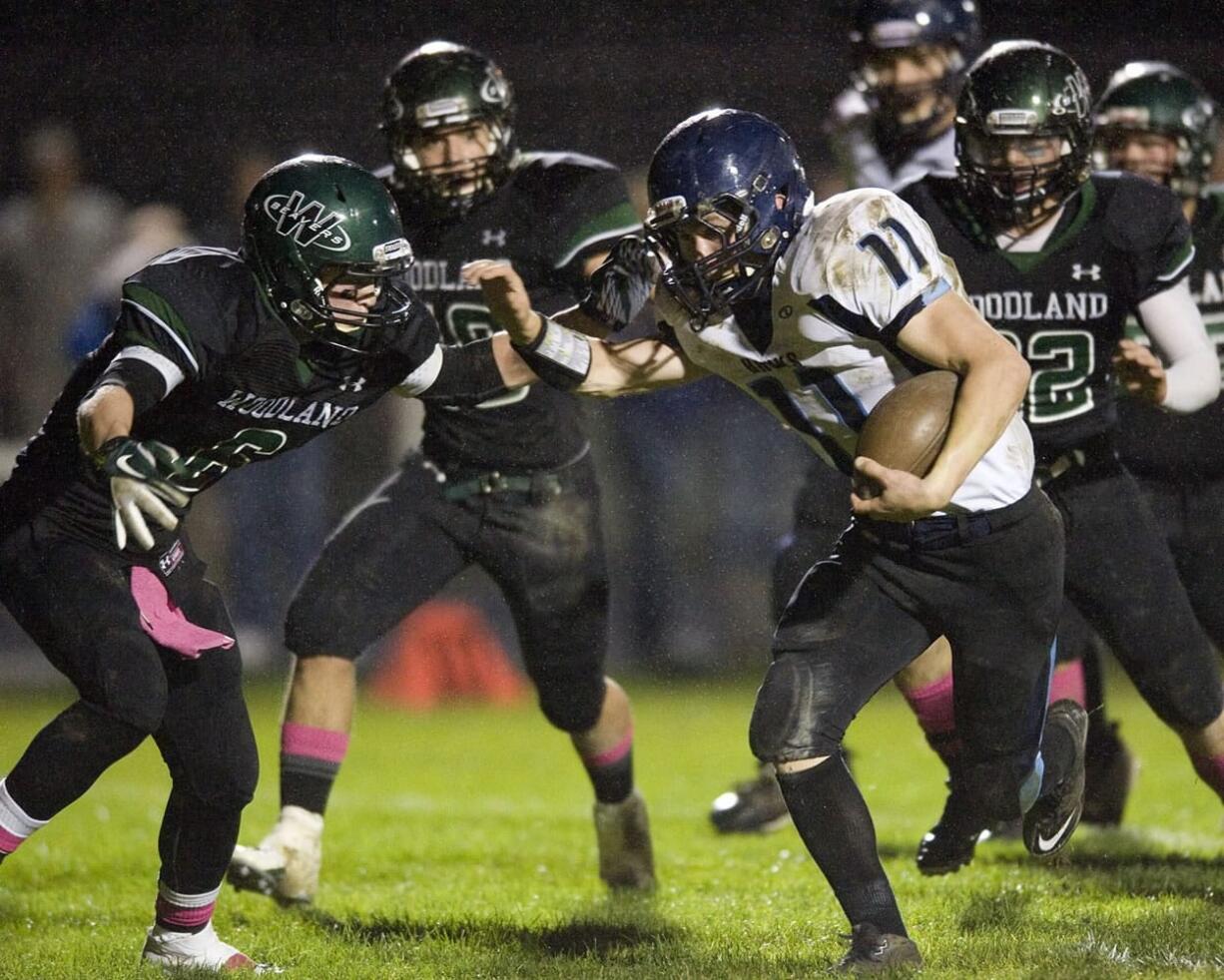 Hockinson's Josiah Niemela (11) rushed for 203 yards and three touchdowns in the victory at Woodland, including one on this play.