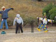 Ambitious scarecrows lined up to impress at the Old Apple Tree Festival.