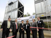 Clark Public Utilities Commissioner Carol Curtis, third from right, helped WaferTech unveil its $1.6 million energy conservation project last year.