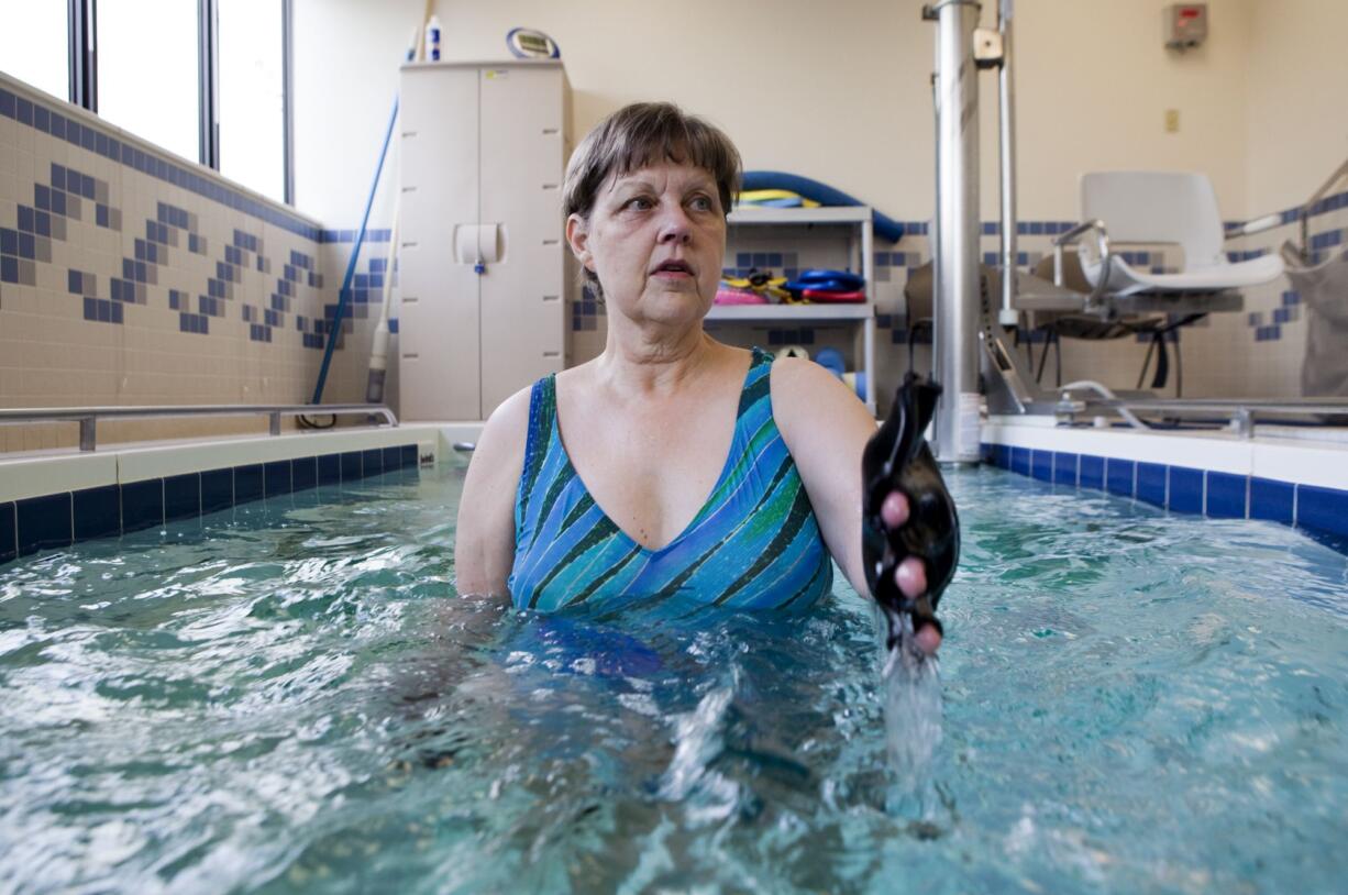 Nadine Blair works with physical therapist Brian Gehley at Rebound Rehabilitation, a program of Southwest Washington Medical Center, to ease Blair's chronic back pain.