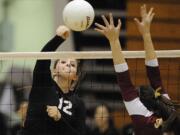 Sydney Schwartz of Camas hits against Prairie's Carissa Campbell in the district title match.