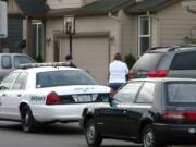 Police are pictured here responding to the Battle Ground home of Clark County sheriff's Detective Ed Owens on Sept. 15, 2010, a day after an accidental shooting there. Owens' 3-year-old son, Ryan, got ahold of his father's gun, accidentally shooting himself.