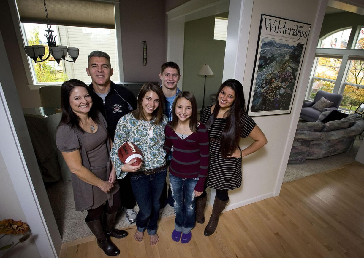 The Eagle family, from left, Debbie, Jon, Olivia, Zach, Sophia, and Natalie all enjoy a connection to football, especially this time of the year.