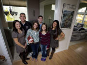 The Eagle family, from left, Debbie, Jon, Olivia, Zach, Sophia, and Natalie all enjoy a connection to football, especially this time of the year.