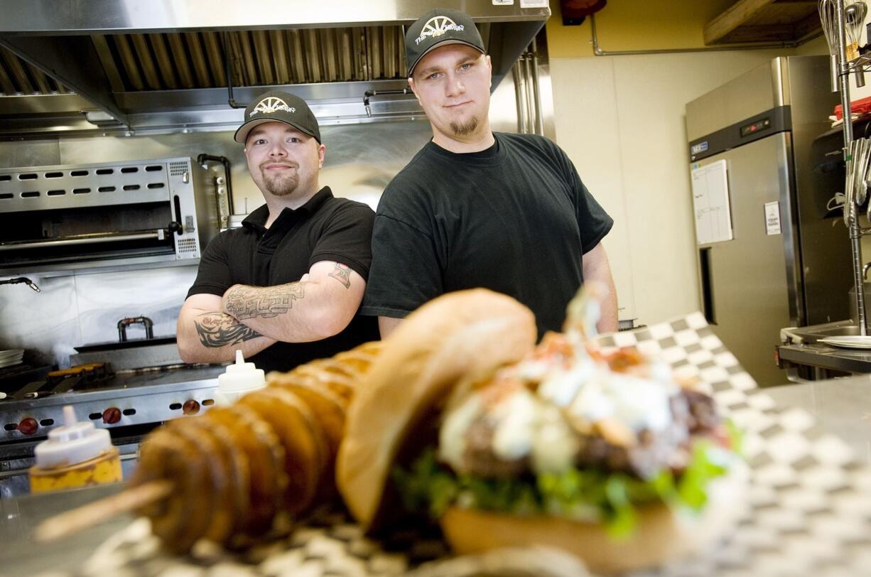 Coachmen restaurant owners Michael Horn, left, and Kevin Basarab say their focus on fresh, local ingredients have helped make their restaurant a success in its first year.