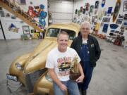 Paul Comeau, left, and his dad Bob Comeau of Comeau Racing, shown with Ol' Gold -- a 1939 Chevrolet sedan.