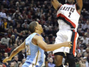 Portland's Wesley Matthews (2) goes up for two of his team-high 25 points over Denver's Andre Miller.