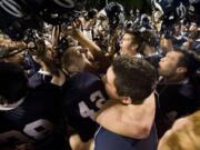 Skyview's Parker Henry (42) celebrates with teammates after beating Union on Oct. 28. The win clinched a fourth consecutive 4A Greater St.