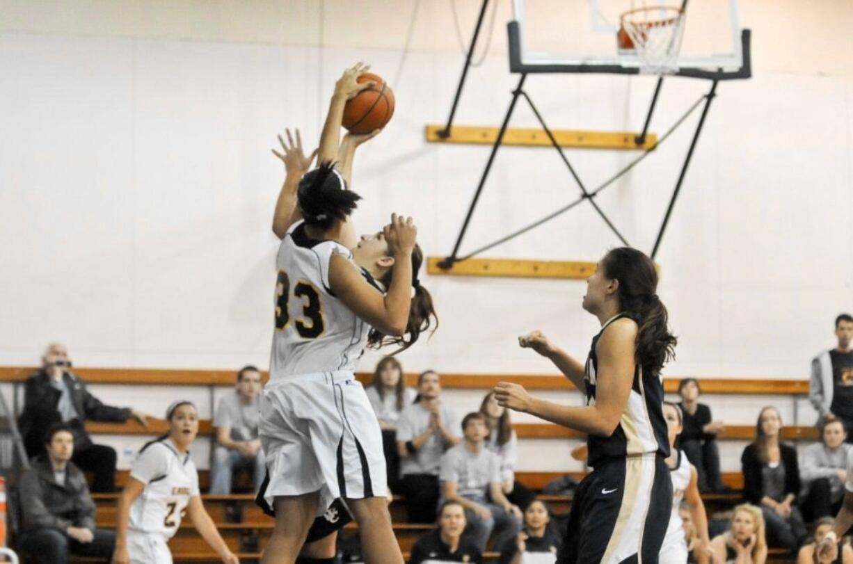 Northwest University's Jessalyn Jackson (33) leads the Cascade Collegiate Conference in scoring, rebounding and blocked shots, and set a conference record with 13 blocks in a Jan. 7 game at Concordia University.