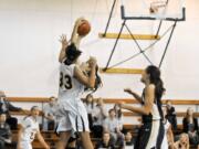 Northwest University's Jessalyn Jackson (33) leads the Cascade Collegiate Conference in scoring, rebounding and blocked shots, and set a conference record with 13 blocks in a Jan. 7 game at Concordia University.