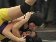 Battle Ground's Hannah Van Osdel (top) pins Columbia River's Sam Schoene for the 137-pound title at the Clark County Championships.