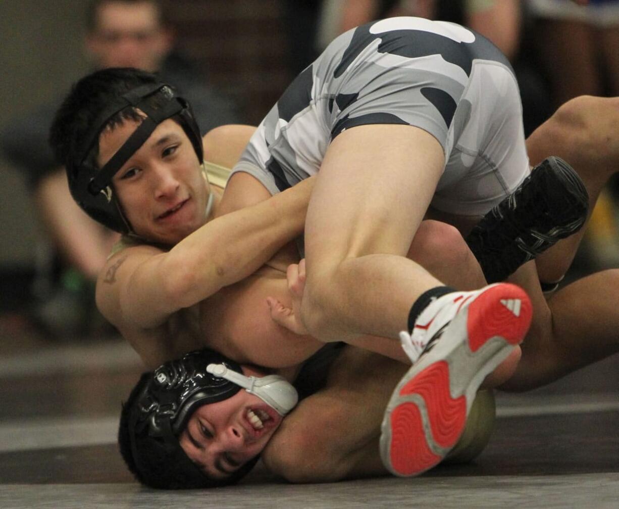 Matthew Nguyen (top) of Evergreen wrestles Junior Godinho of Union.