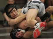 Matthew Nguyen (top) of Evergreen wrestles Junior Godinho of Union.